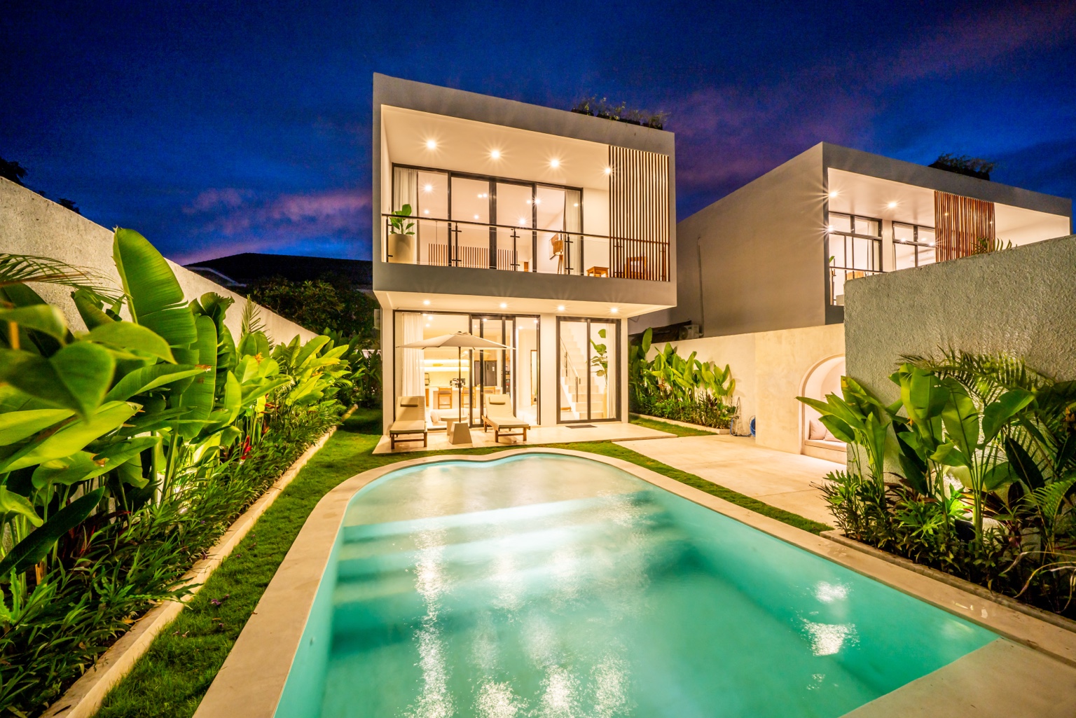 Palm Serenity Estate at night